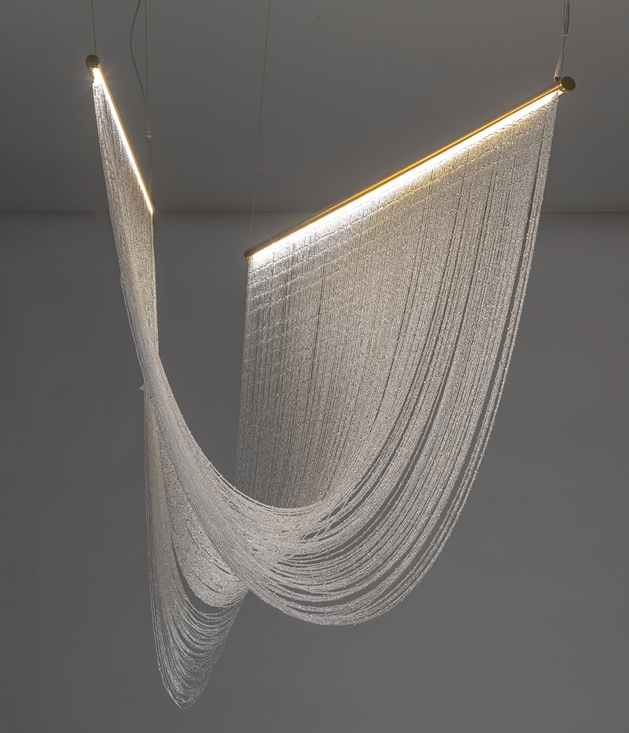 Pendant lamp with hand-sewn crystal spheres