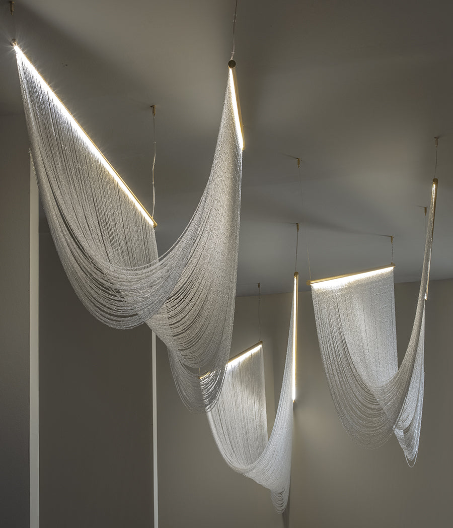 Pendant lamp with hand-sewn crystal spheres