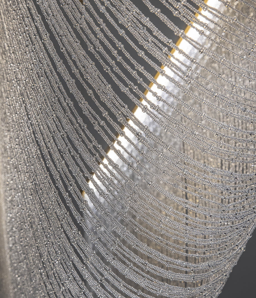 Pendant lamp with hand-sewn crystal spheres