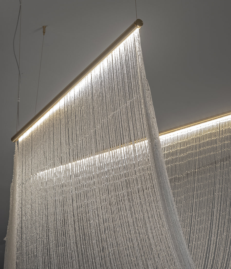 Pendant lamp with hand-sewn crystal spheres